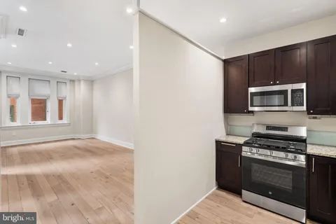 a kitchen with a stove and a microwave