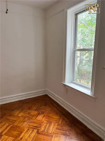 a kitchen with granite countertop wooden cabinets and a stove top oven