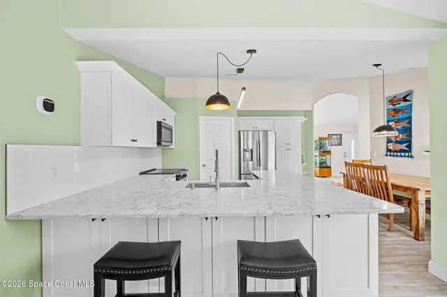 a living room with furniture and large window