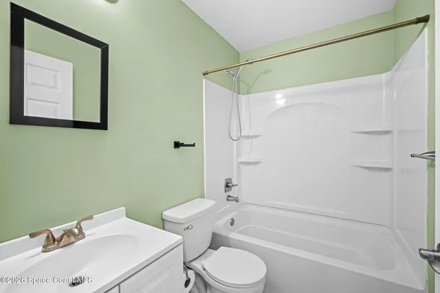 a bedroom with bed and a window