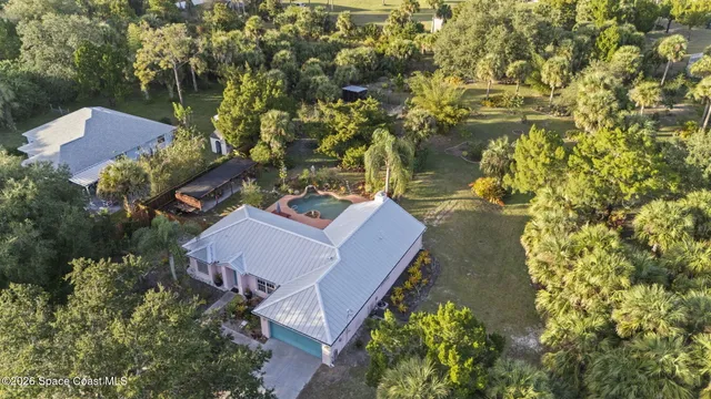 a backyard of a house with lots of green space