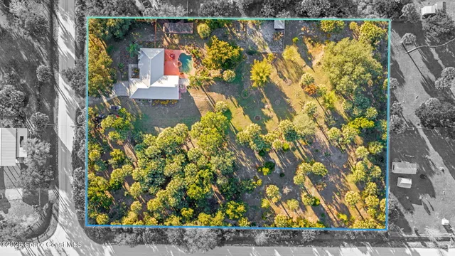 a view of swimming pool with a yard