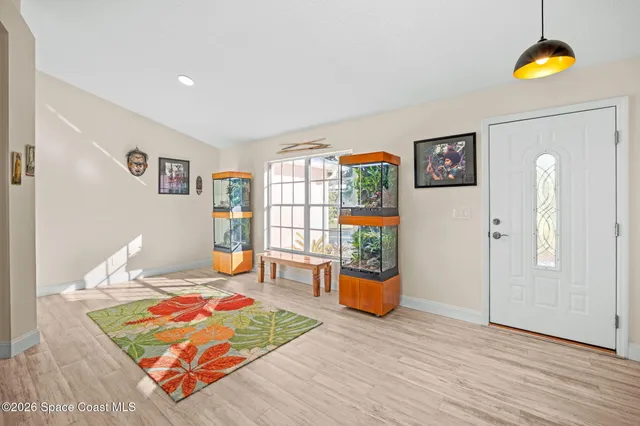 a living room with furniture and window