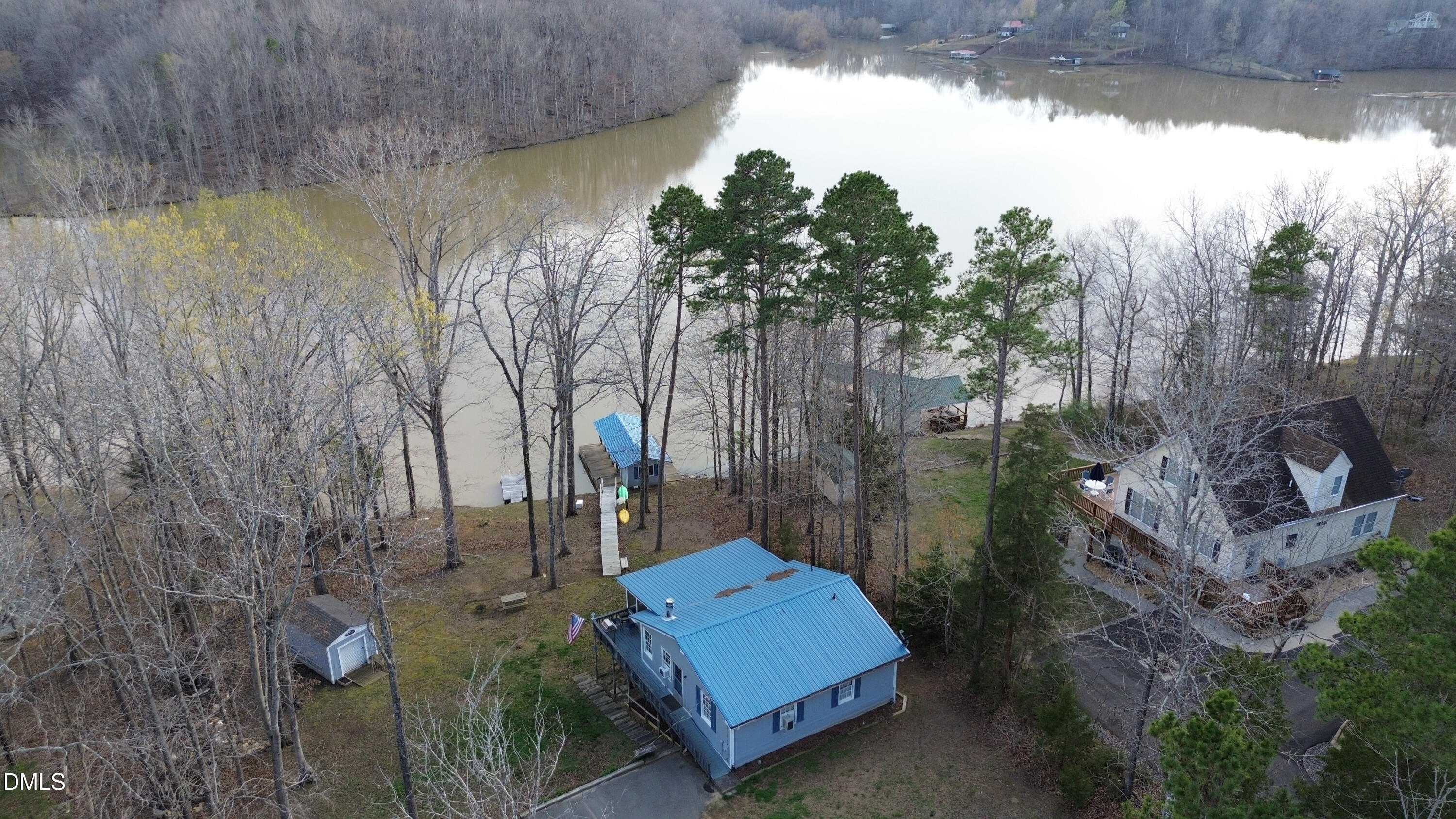1088 Hyco Hills Road Semora, NC 27343 - Photo 18 of 27 a backyard of a house with outdoor seating and green space