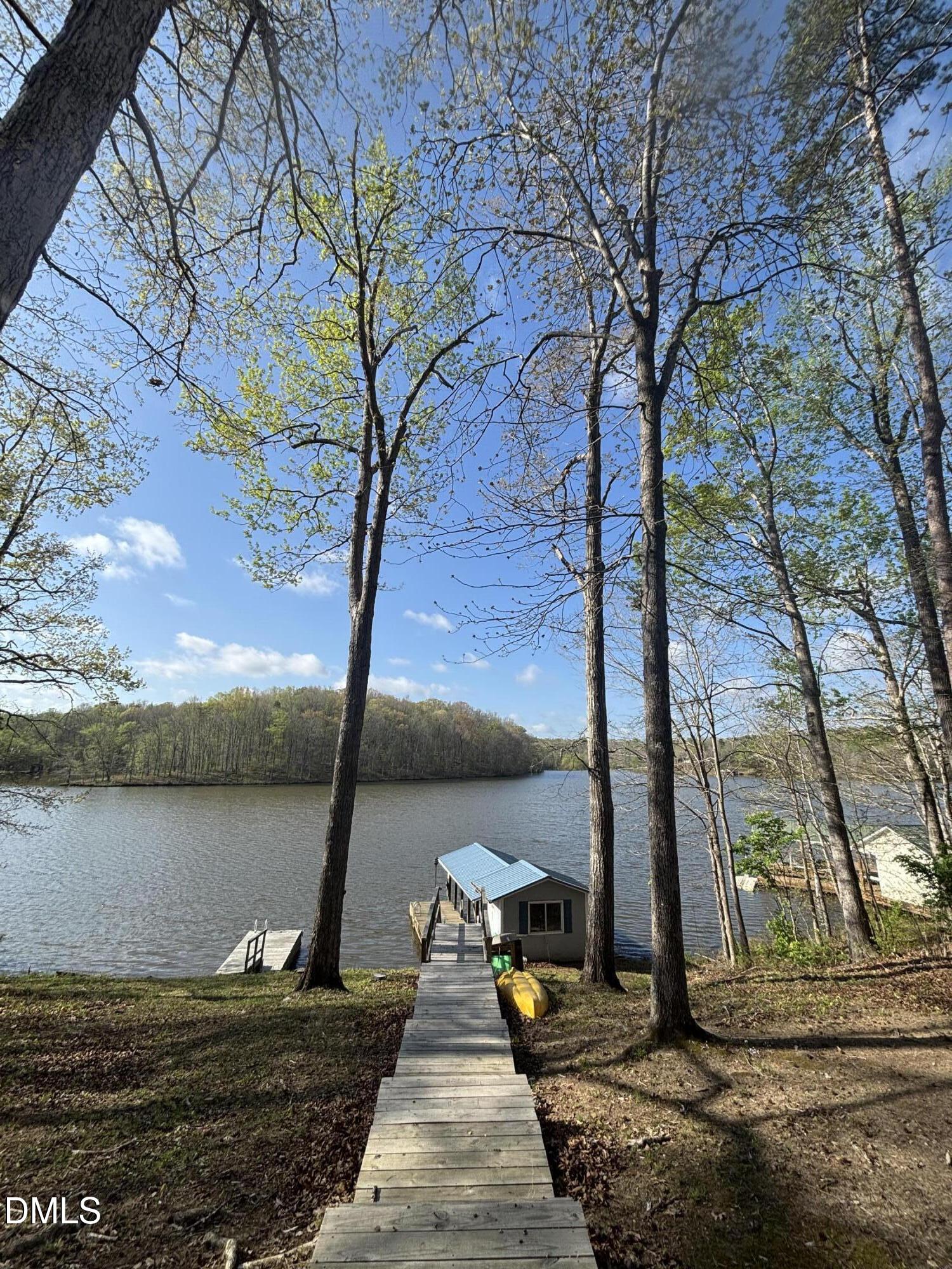 1088 Hyco Hills Road Semora, NC 27343 - Photo 20 of 27 a view of a lake with a tree