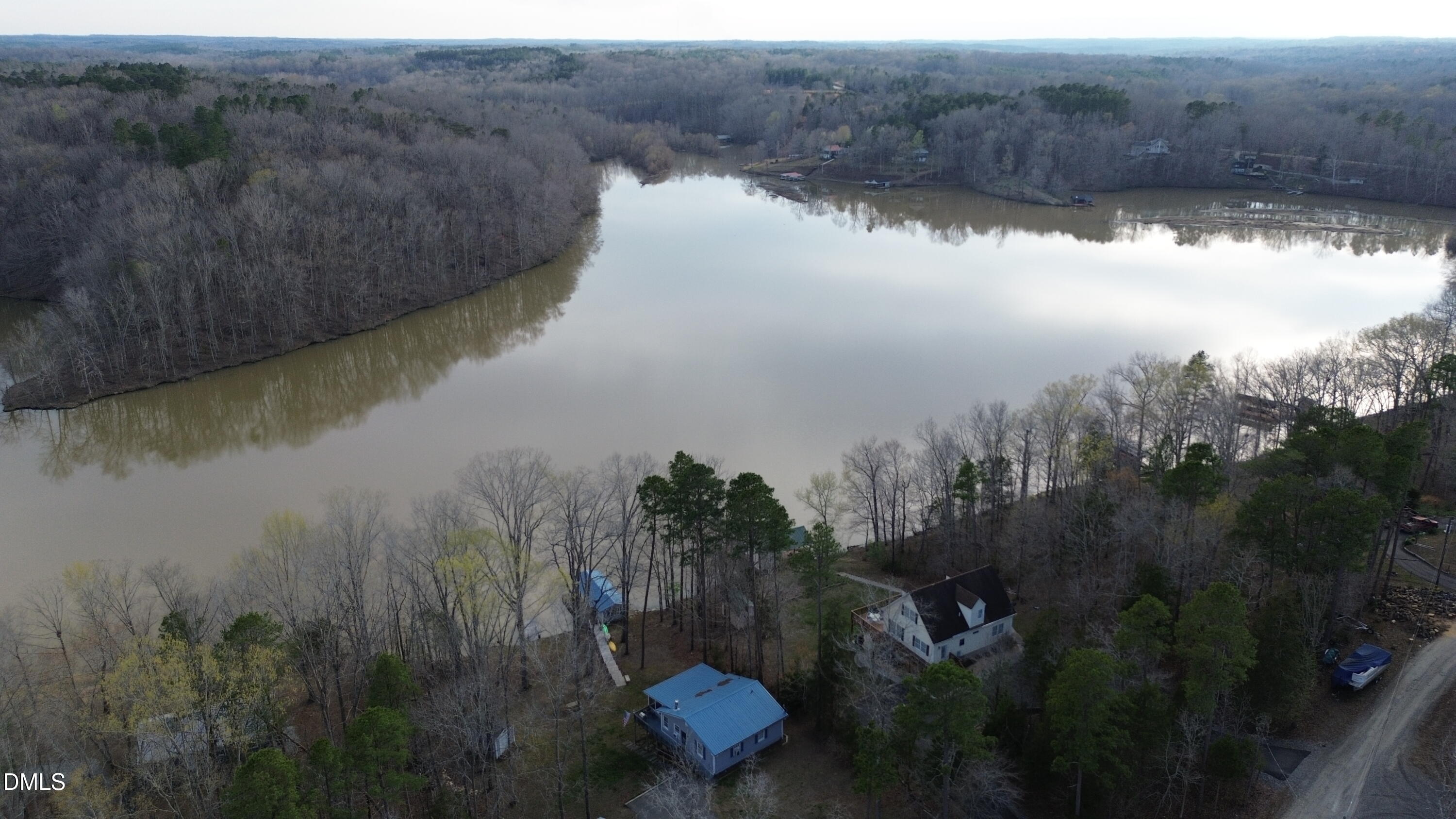 1088 Hyco Hills Road Semora, NC 27343 - Photo 21 of 27 a view of a lake from a yard