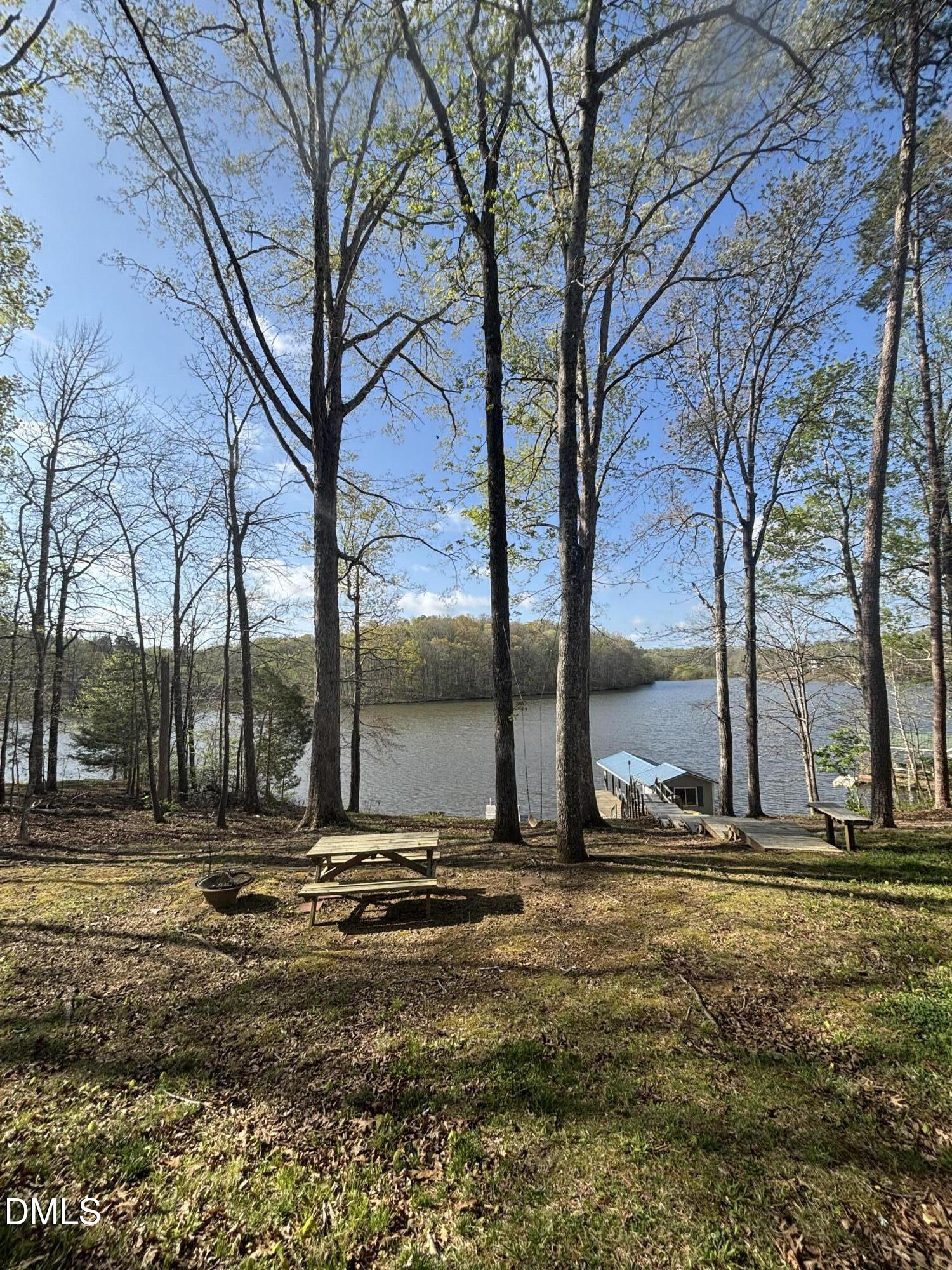 1088 Hyco Hills Road Semora, NC 27343 - Photo 27 of 27 a view of tall trees with wooden fence