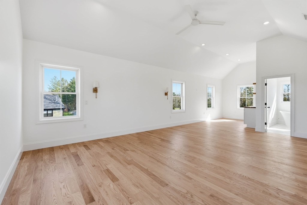 16 Couture Way Middleton, MA 01949 - Photo 19 of 36 a view of an empty room with wooden floor and a window