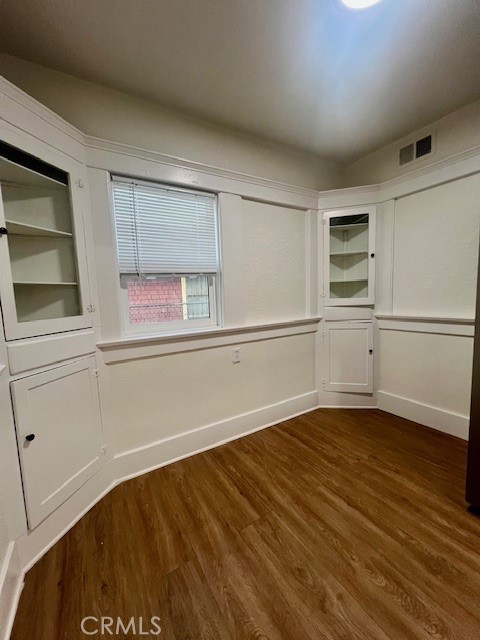 580 West 21st Street San Bernardino, CA 92405 - Photo 11 of 22 a view of an empty room with wooden floor and a window