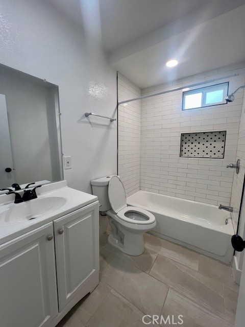 580 West 21st Street San Bernardino, CA 92405 - Photo 15 of 22 a bathroom with a sink a toilet and bathtub
