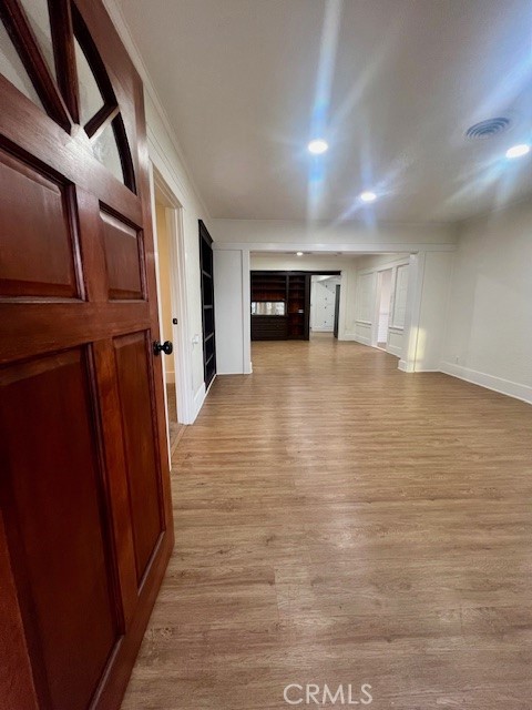 580 West 21st Street San Bernardino, CA 92405 - Photo 4 of 22 a view of empty room with wooden floor