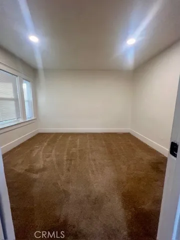 en empty room with windows