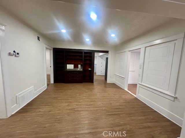 580 West 21st Street San Bernardino, CA 92405 - Photo 8 of 22 a view of empty room with wooden floor