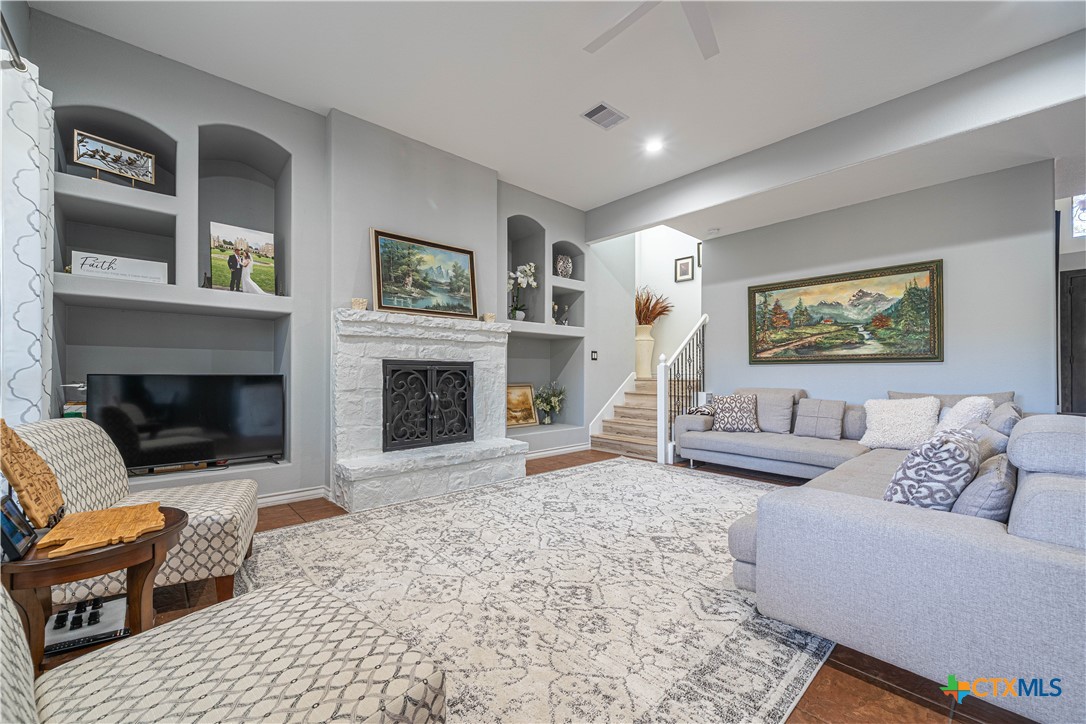 519 Long Meadow Spring Branch, TX 78070 - Photo 8 of 33 a living room with furniture and a fireplace