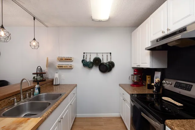 a kitchen with a sink and cabinets