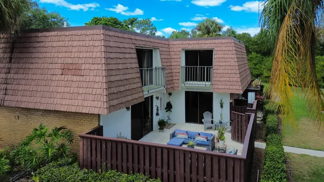 a backyard of a house with seating space