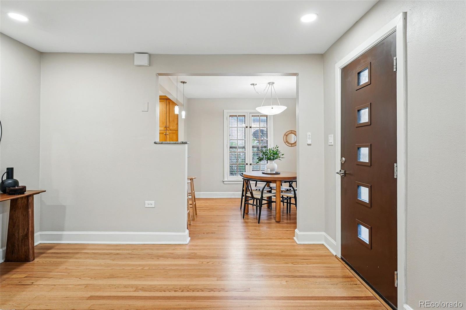 1312 Ash Street Denver, CO 80220 - Photo 11 of 31 a view of a livingroom with furniture and wooden floor
