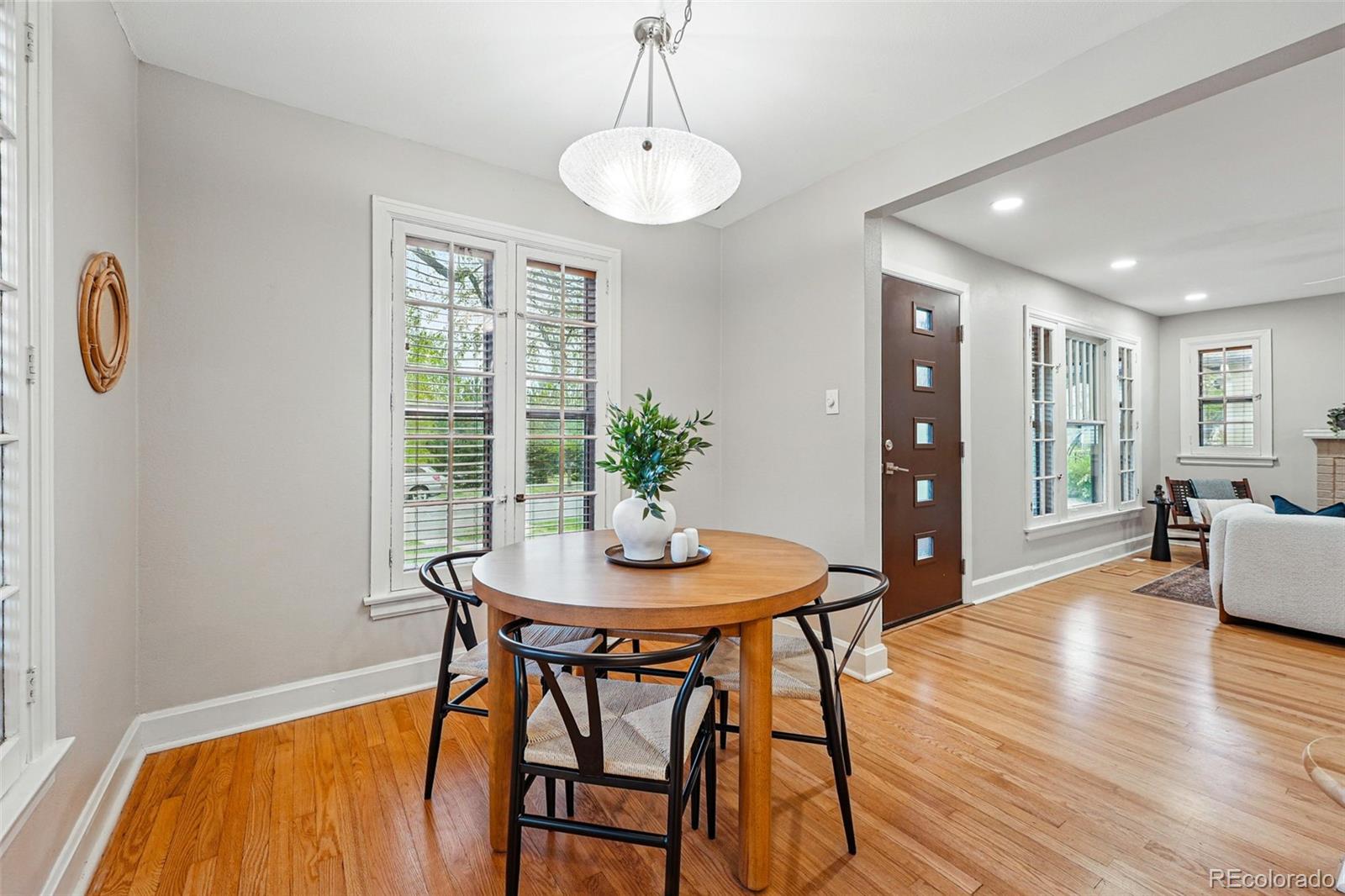 1312 Ash Street Denver, CO 80220 - Photo 12 of 31 a dining room with furniture and wooden floor