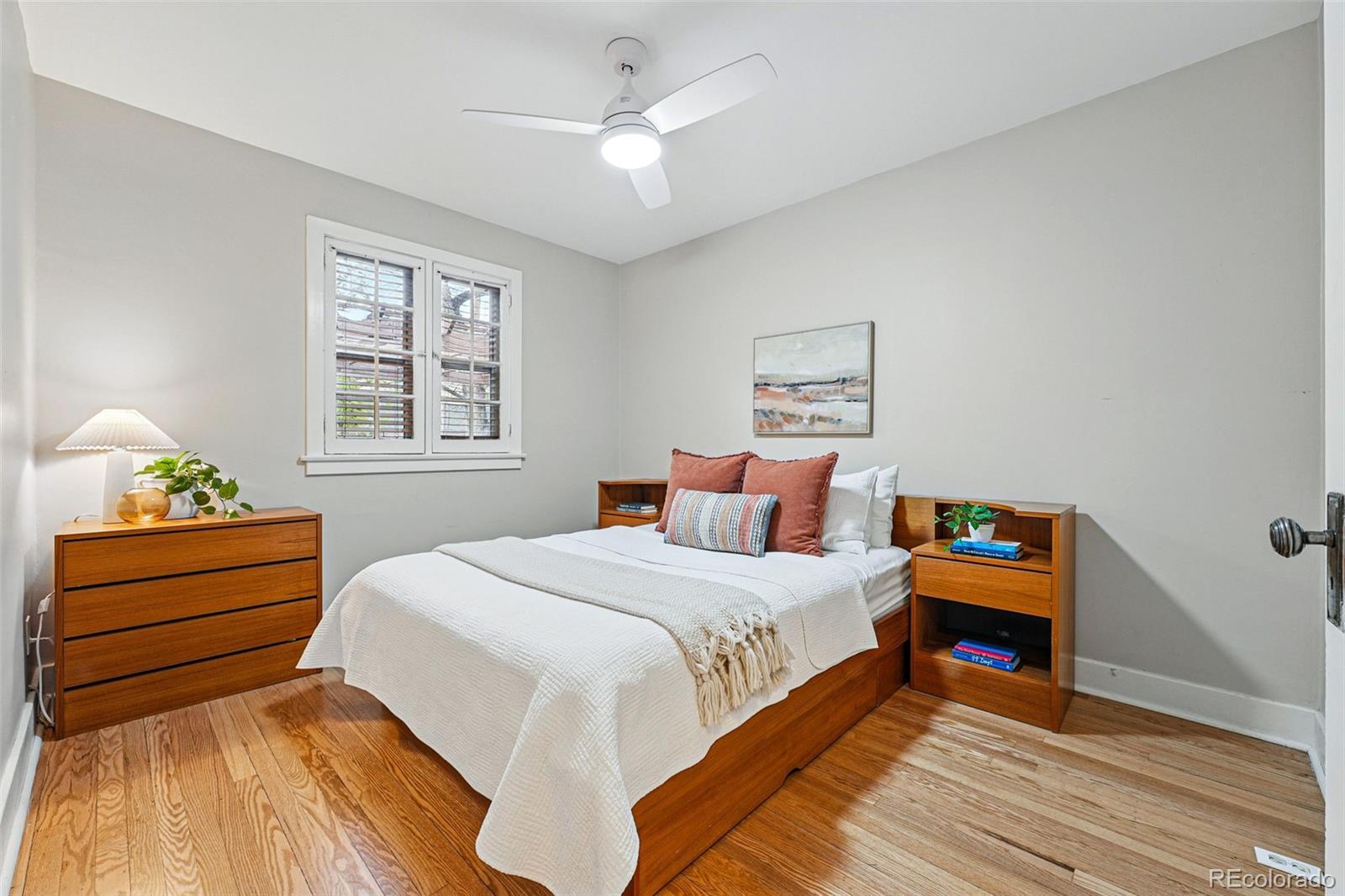 1312 Ash Street Denver, CO 80220 - Photo 17 of 31 a bedroom with a bed and a dresser
