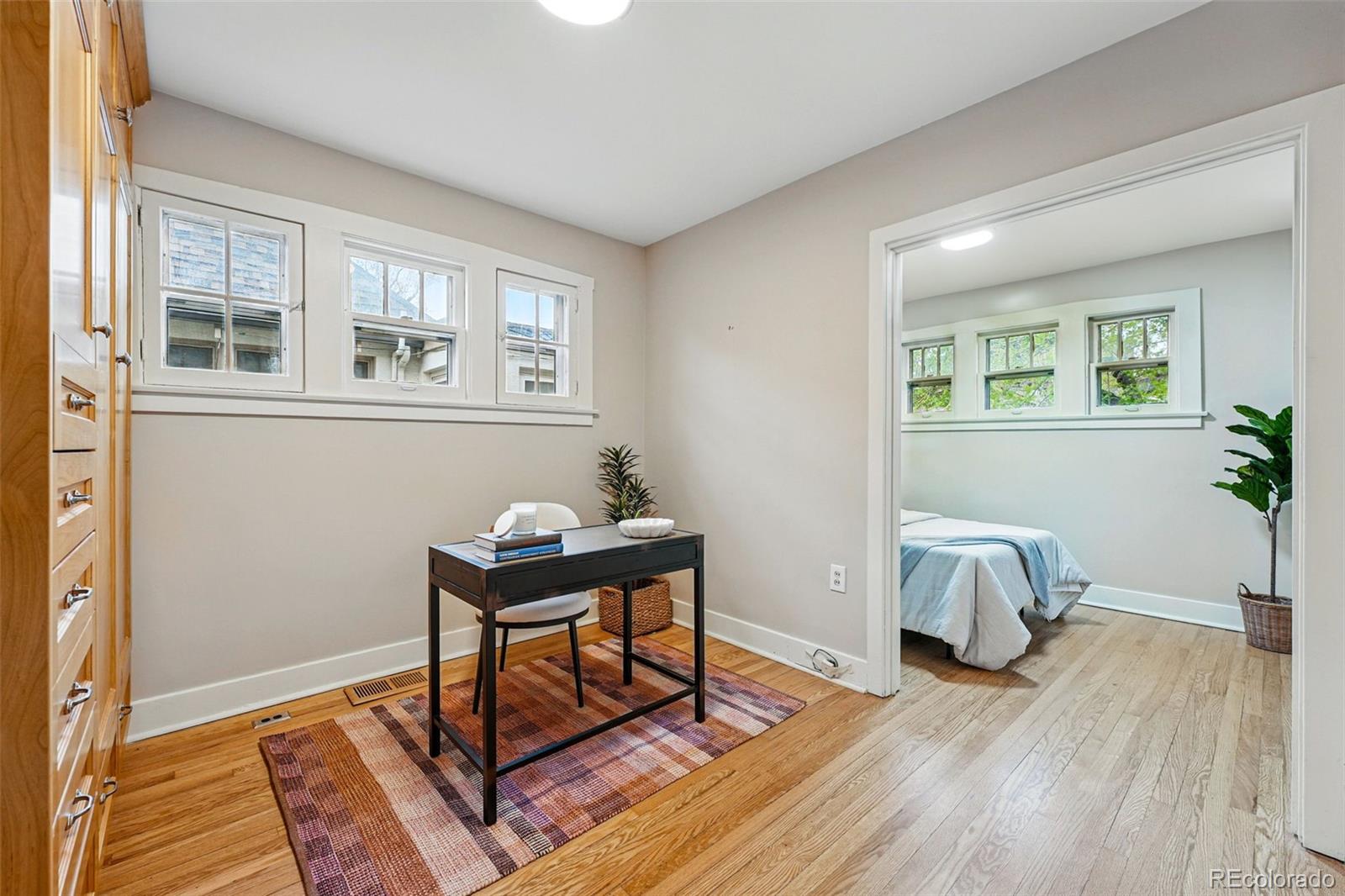 1312 Ash Street Denver, CO 80220 - Photo 21 of 31 a workspace with wooden floor