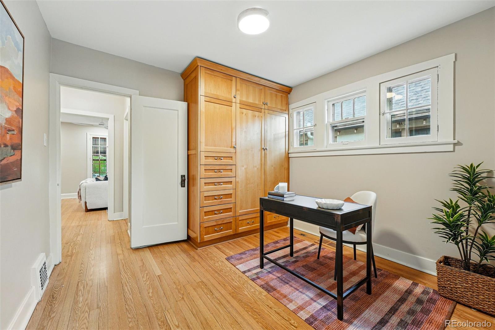 1312 Ash Street Denver, CO 80220 - Photo 22 of 31 a view of a livingroom with furniture and wooden floor