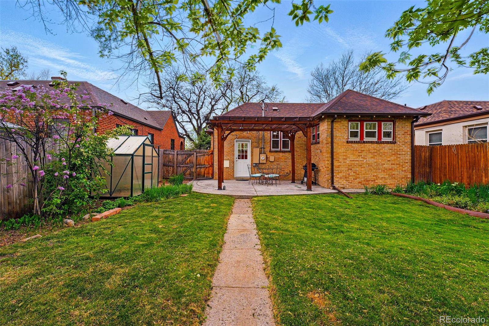 1312 Ash Street Denver, CO 80220 - Photo 30 of 31 a front view of a house with a yard