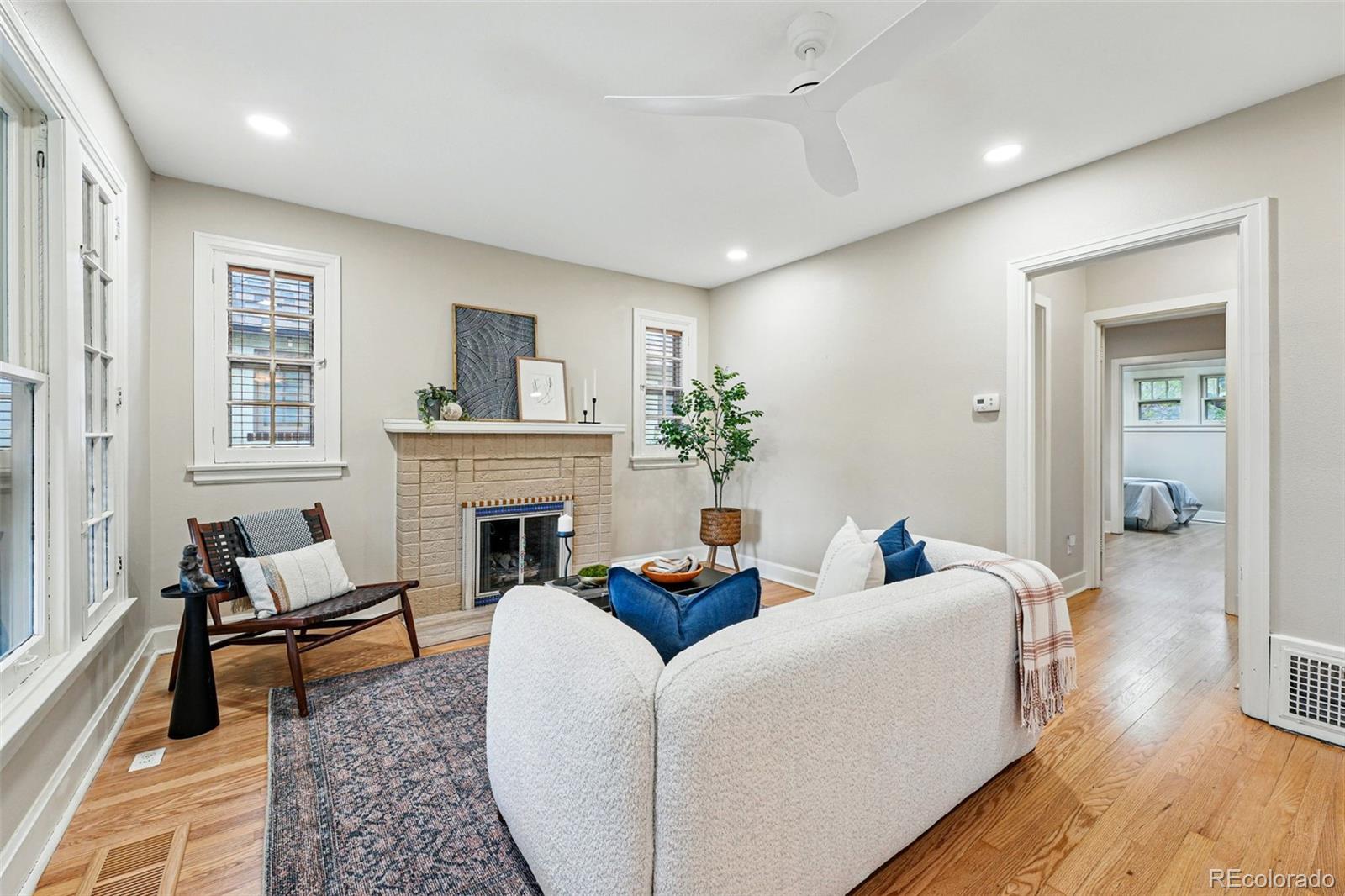 1312 Ash Street Denver, CO 80220 - Photo 7 of 31 a living room with furniture and a fireplace