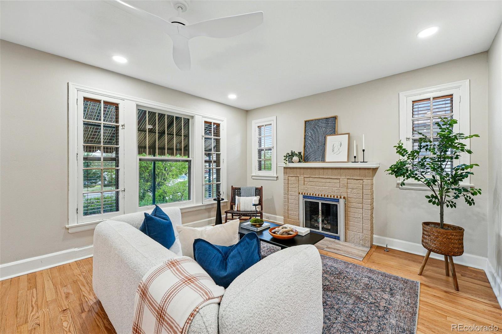 1312 Ash Street Denver, CO 80220 - Photo 8 of 31 a living room with furniture fireplace and window