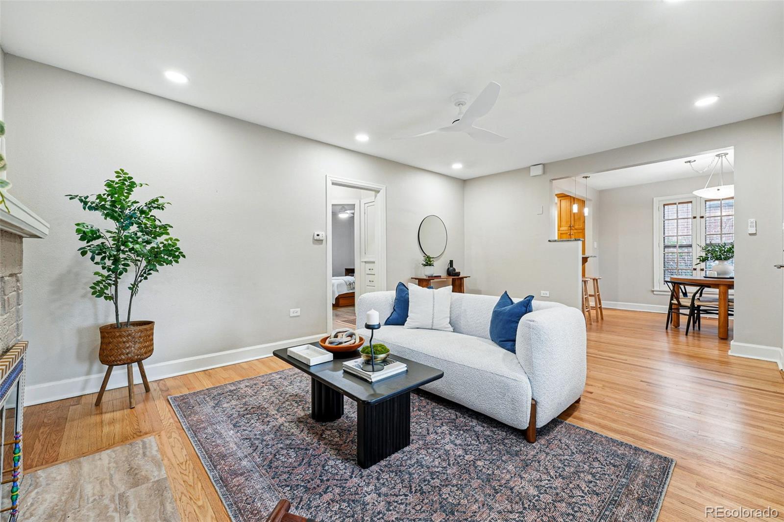 1312 Ash Street Denver, CO 80220 - Photo 10 of 31 a living room with furniture and a potted plant