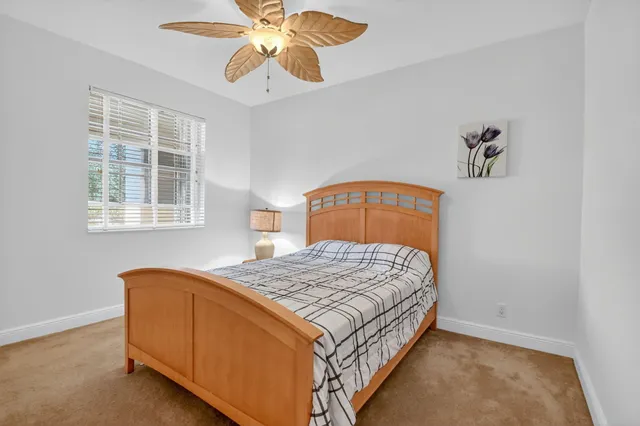 a view of a porch with furniture and a potted plants