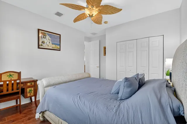 an aerial view of residential houses with outdoor space and lake view