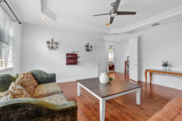 an aerial view of a house with a yard and lake view