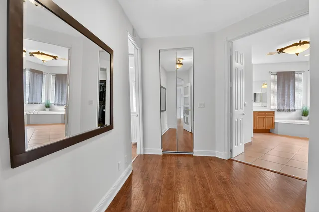 an aerial view of a house with a garden and lake view