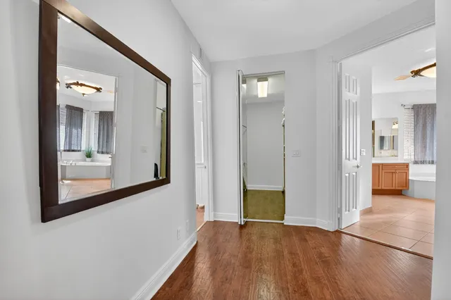 an aerial view of residential houses with outdoor space and ocean view