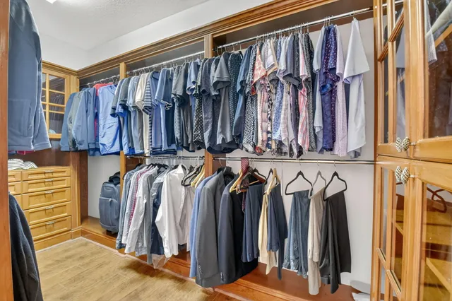 an aerial view of a house with a garden and lake view