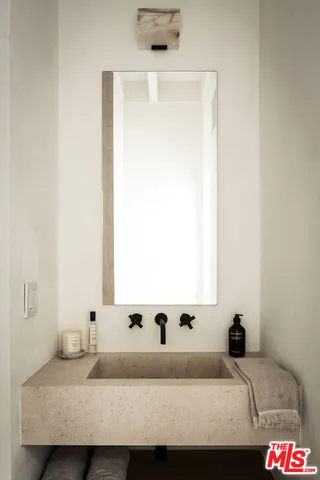 a kitchen with a table and chairs