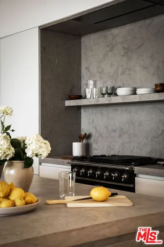 a kitchen with a stove and a table