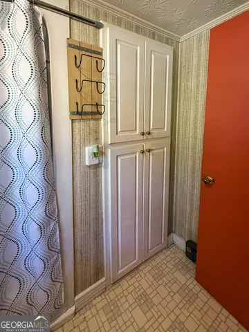 a view of a entryway door with wooden floor