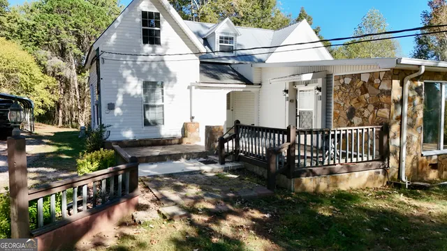 a view of a house with wooden fence