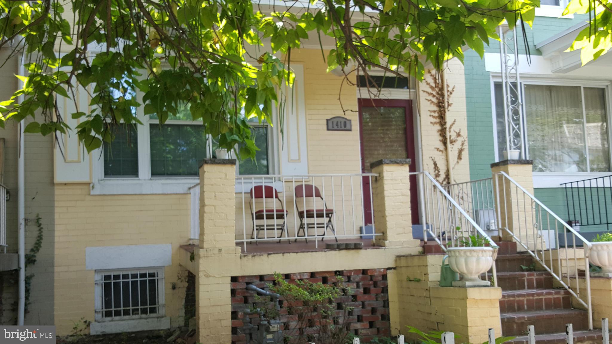 a view of a house with a tree