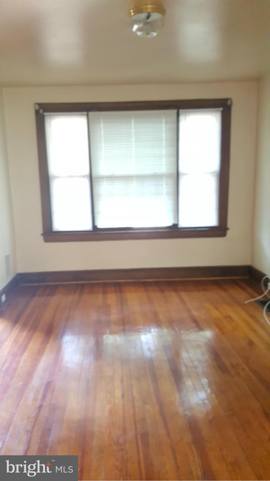 1410 Perry Place Northwest Washington, DC 20010 - Photo 7 of 11 an empty room with a window
