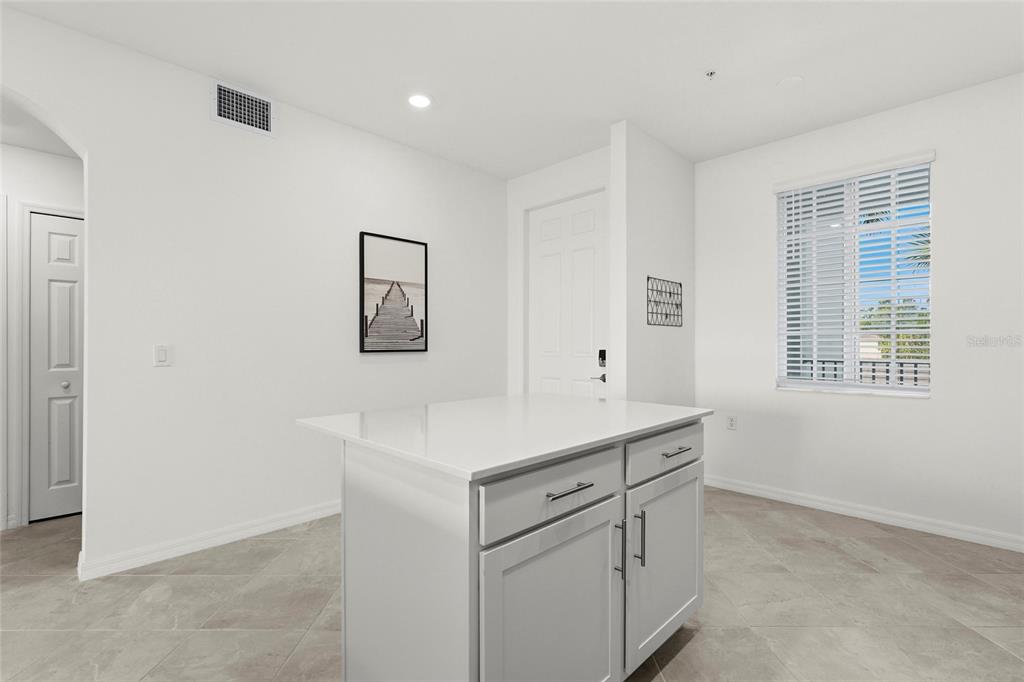 43985 Boardwalk Loop, Unit 2124 Punta Gorda, FL 33982 - Photo 16 of 80 a room with a sink cabinets and a window