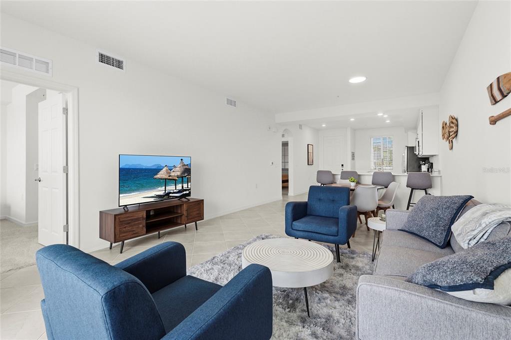 43985 Boardwalk Loop, Unit 2124 Punta Gorda, FL 33982 - Photo 21 of 80 a living room with furniture and a flat screen tv