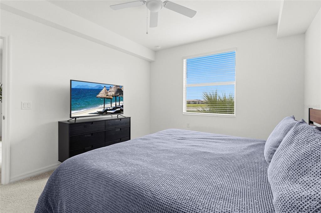 43985 Boardwalk Loop, Unit 2124 Punta Gorda, FL 33982 - Photo 22 of 80 a bedroom with a bed and a tv