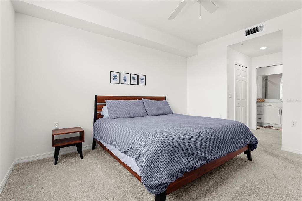 43985 Boardwalk Loop, Unit 2124 Punta Gorda, FL 33982 - Photo 23 of 80 a bedroom with a bed and a table