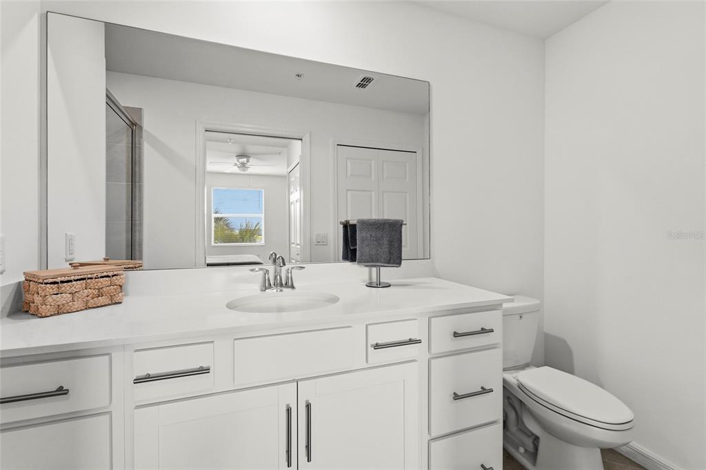 43985 Boardwalk Loop, Unit 2124 Punta Gorda, FL 33982 - Photo 24 of 80 a view of bathroom with a sink toilet mirror and vanity