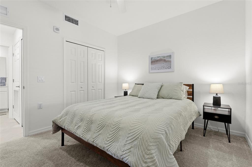 43985 Boardwalk Loop, Unit 2124 Punta Gorda, FL 33982 - Photo 27 of 80 a bedroom with a bed and a night stand