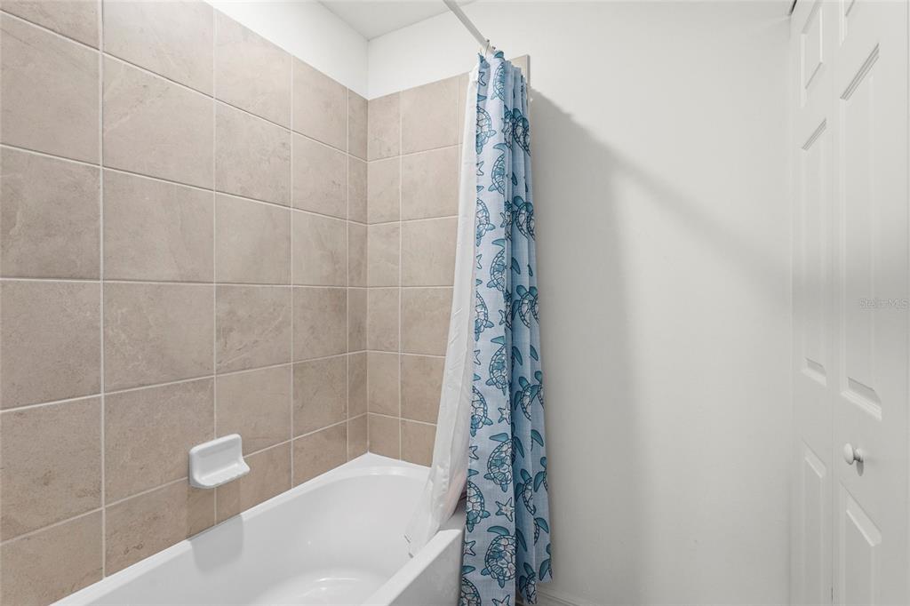 43985 Boardwalk Loop, Unit 2124 Punta Gorda, FL 33982 - Photo 29 of 80 a bathroom with a bathtub and shower