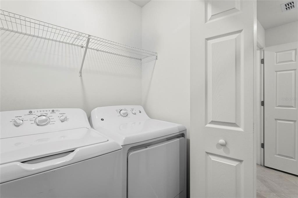 43985 Boardwalk Loop, Unit 2124 Punta Gorda, FL 33982 - Photo 30 of 80 a utility room with dryer and washer