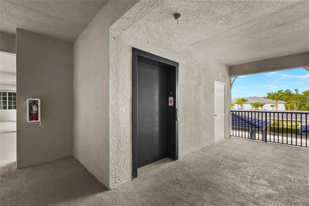 43985 Boardwalk Loop, Unit 2124 Punta Gorda, FL 33982 - Photo 36 of 80 a view of a hallway with a porch